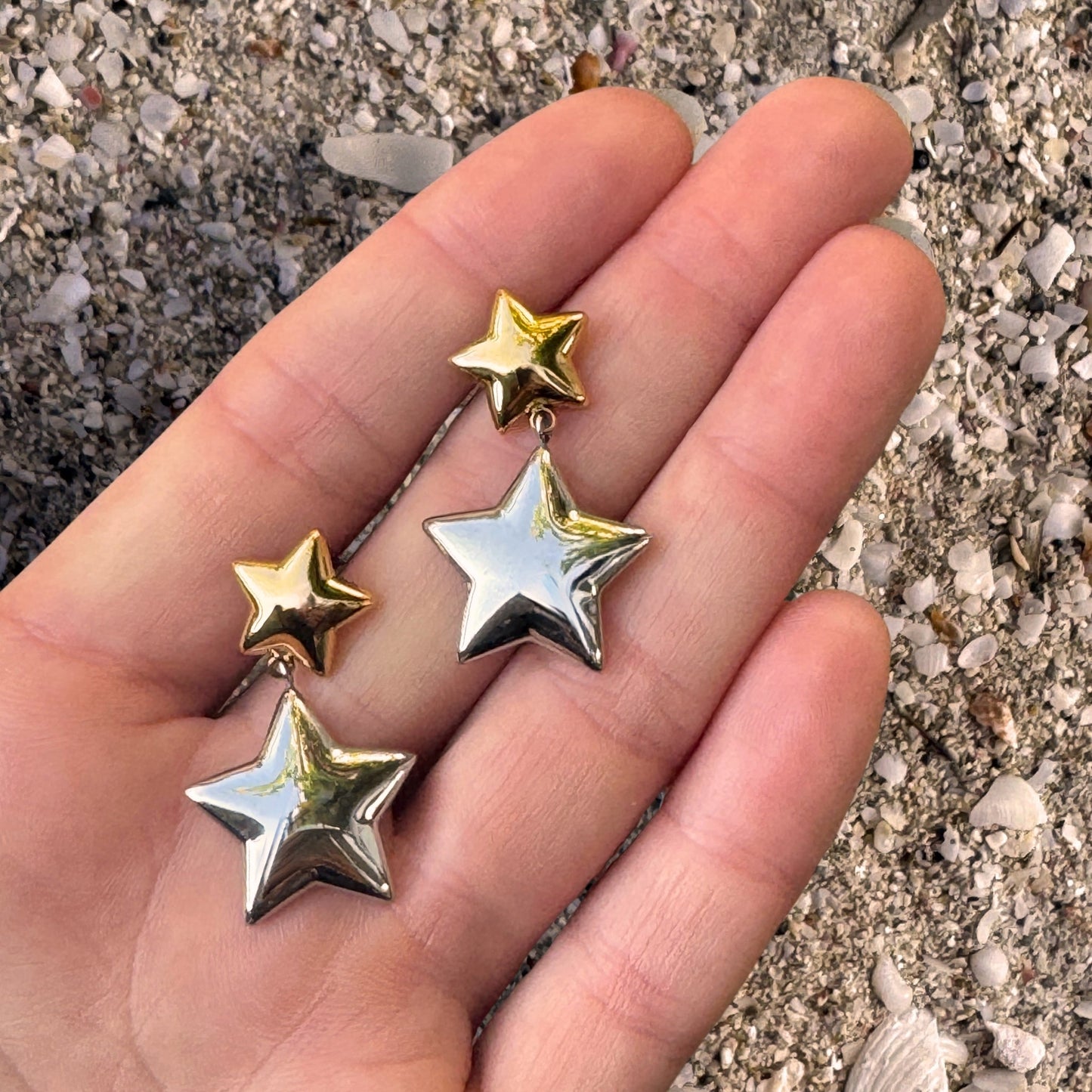 Double Star Gold and Silver Danglies in hand