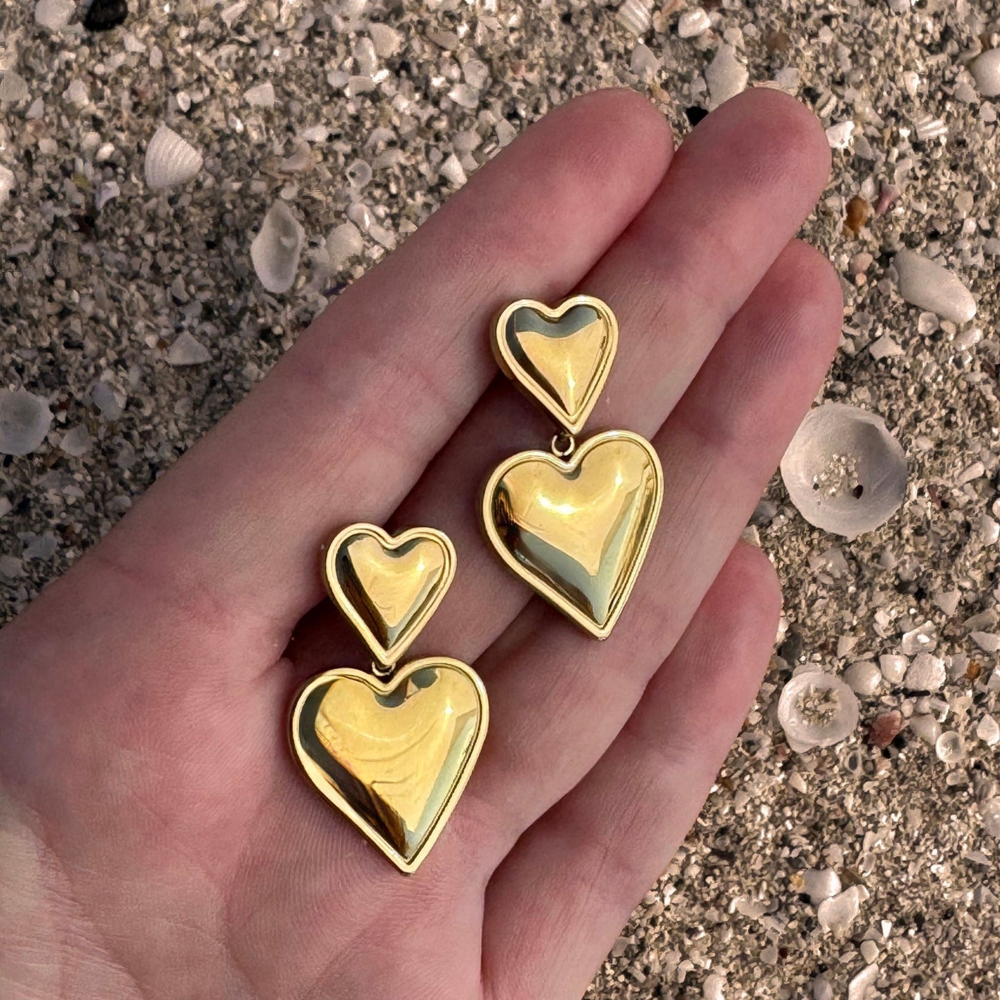 Gold Double Heart Danglies in hand