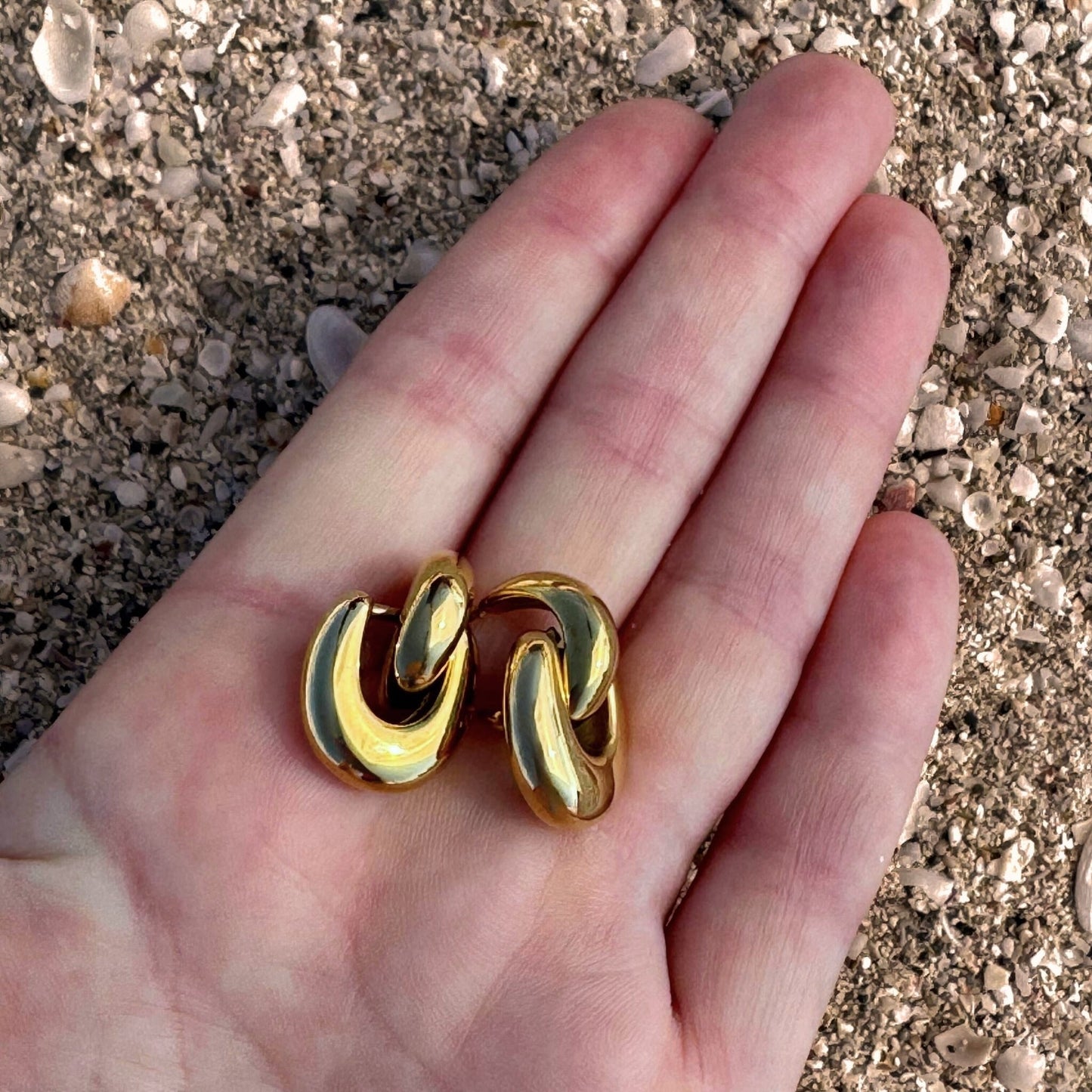 Gold Horseshoe Double Danglies in hand