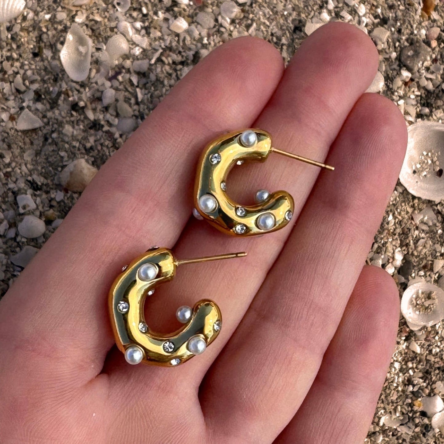Zircon & Pearl Gold Plated Molten C-Shape Earrings in hand