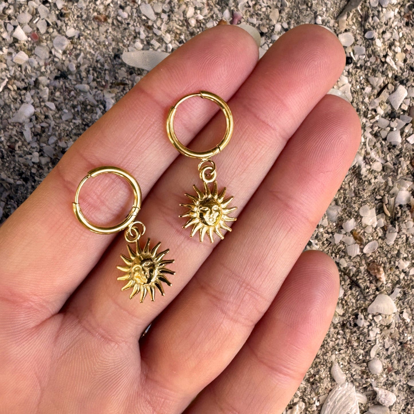 Sun Face Hoop Earrings in hand