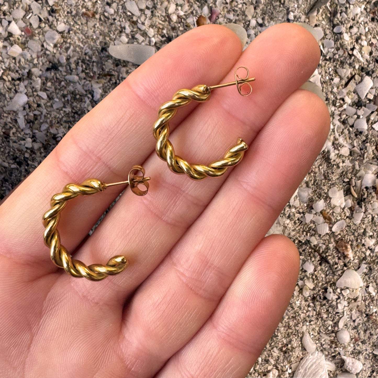 Gold Twisted Rope C-Shape Hoop Earrings in hand