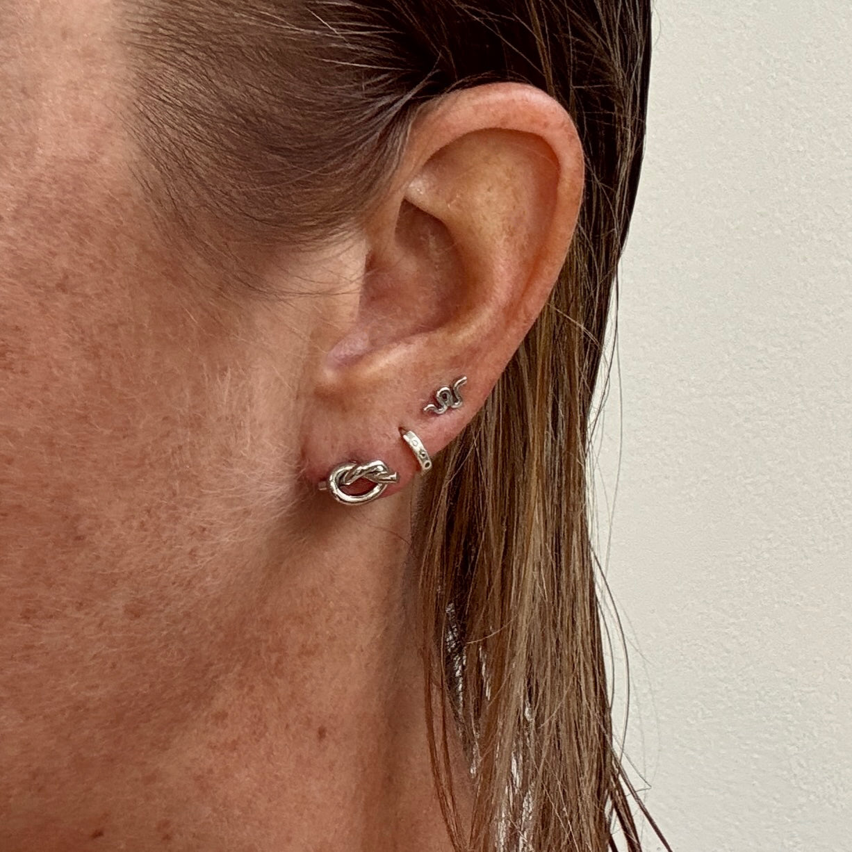 Silver Knot Studs from Jessica Rose Jewellery on ear