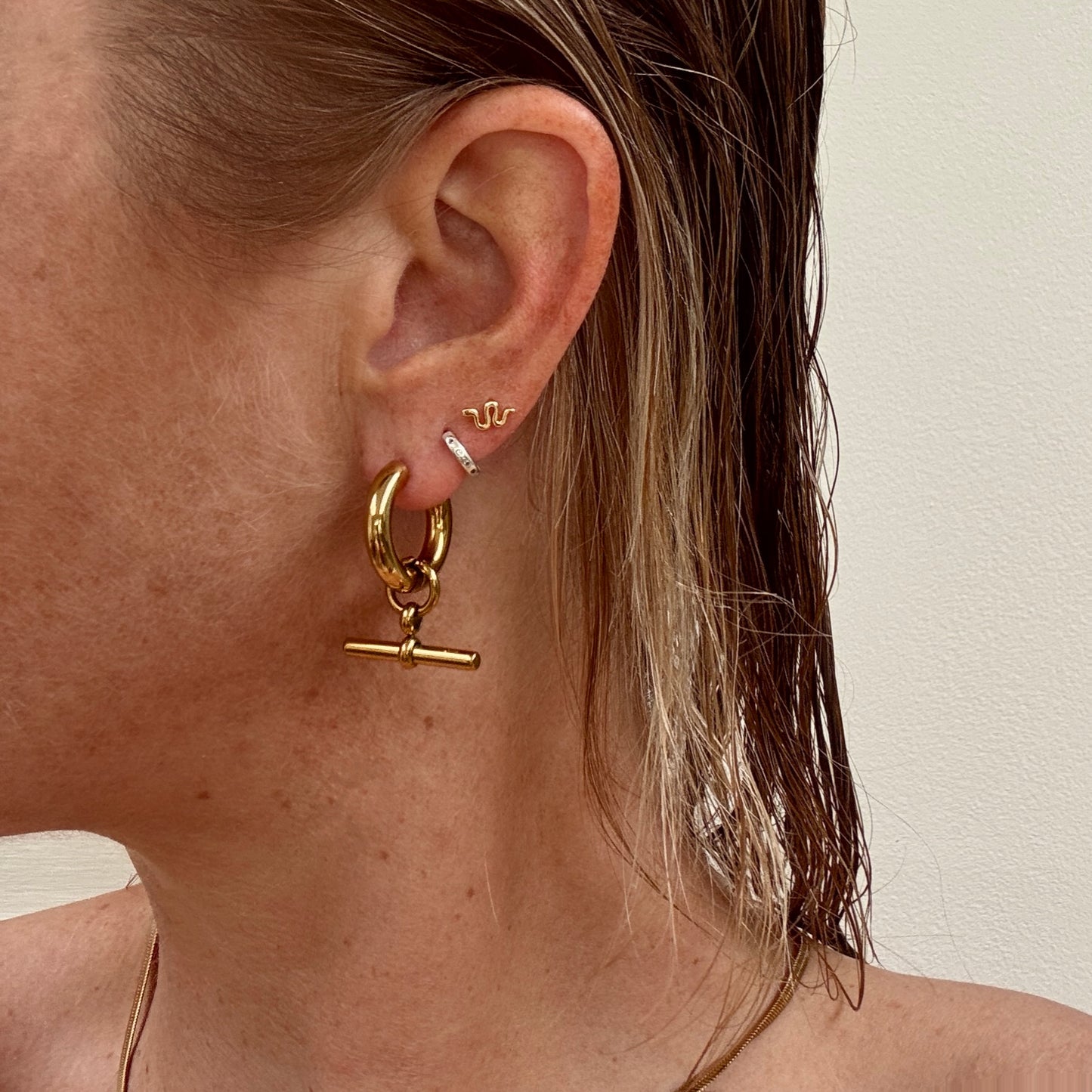 Gold plated t-bar hoop huggie earrings from Jessica Rose jewellery