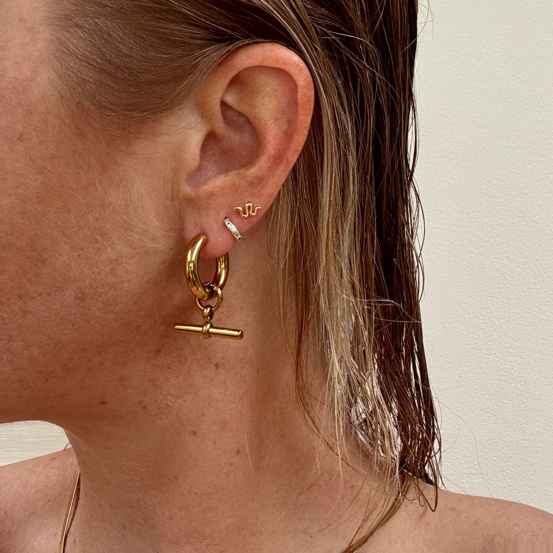Gold plated t-bar hoop huggie earrings from Jessica Rose jewellery