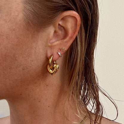Gold plated chunky pierced heart huggie earrings from Jessica Rose jewellery