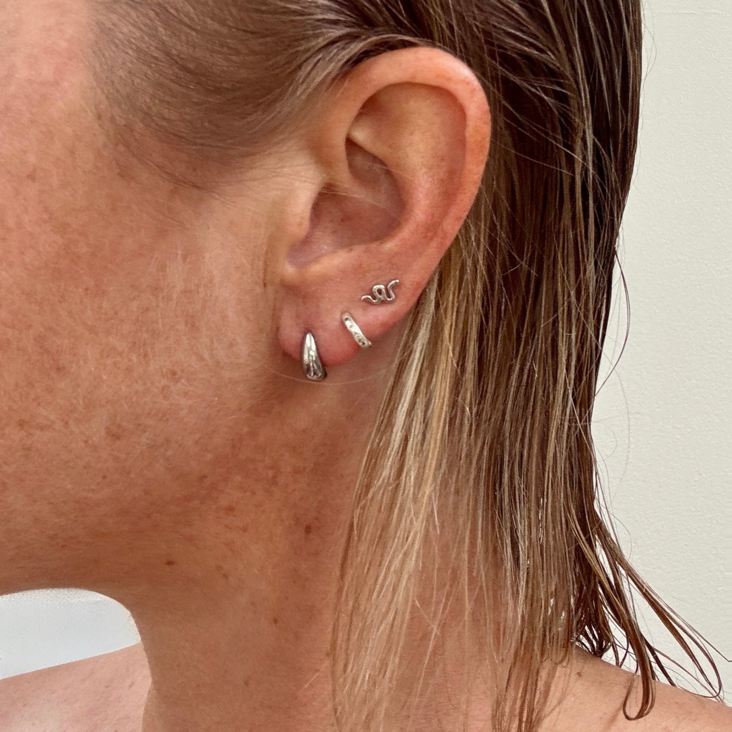 Silver Tear Drop Studs from Jessica Rose Jewellery on ear