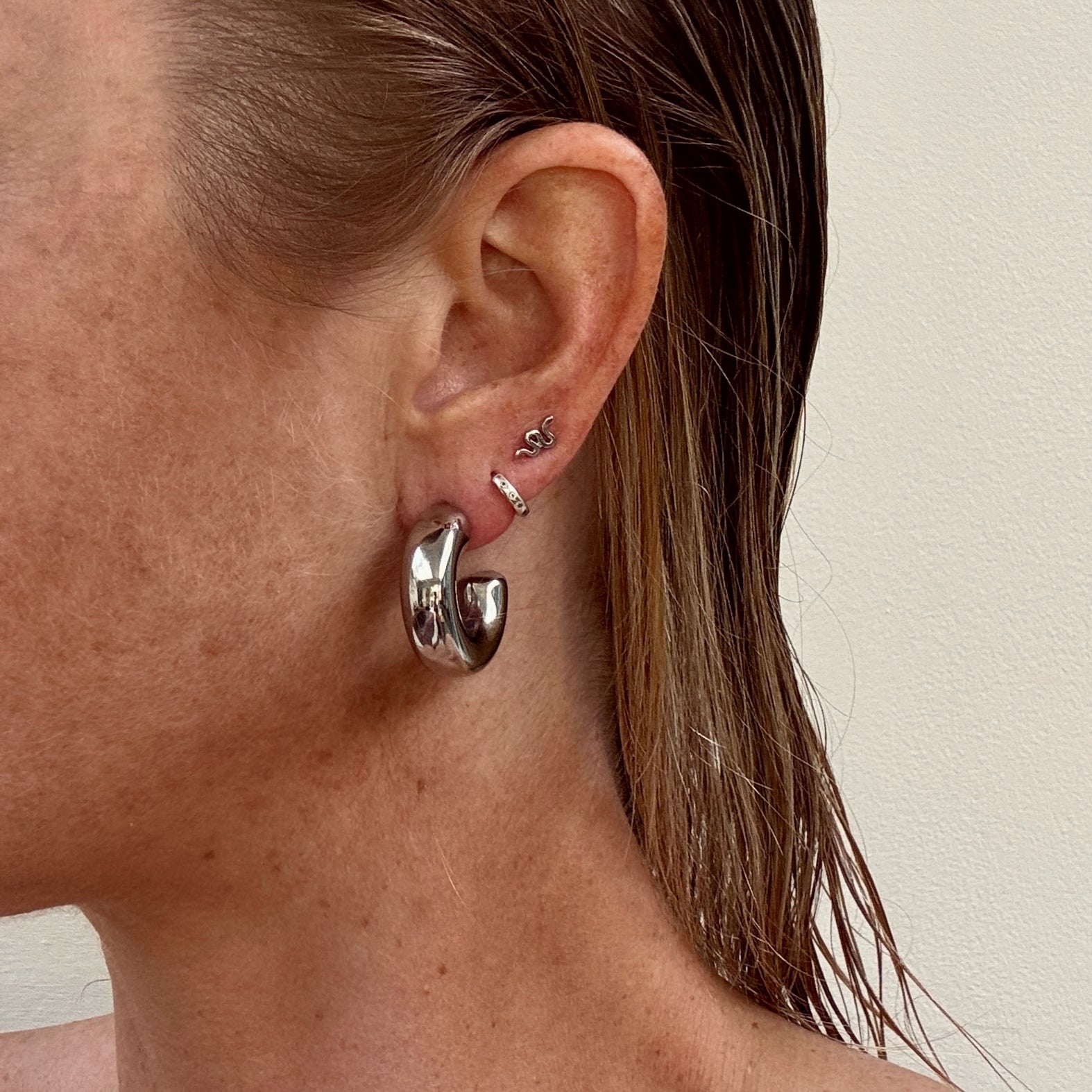 Chunky silver C-shape hoop earrings from Jessica Rose jewellery