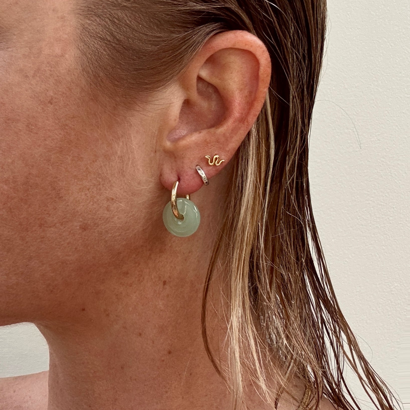 Green jade double hoop gold plated hoop earrings from Jessica Rose jewellery worn on ear