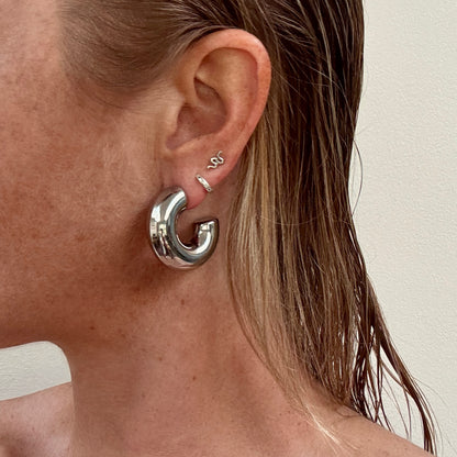 Large chunky silver C-shape hoop earrings from Jessica Rose jewellery
