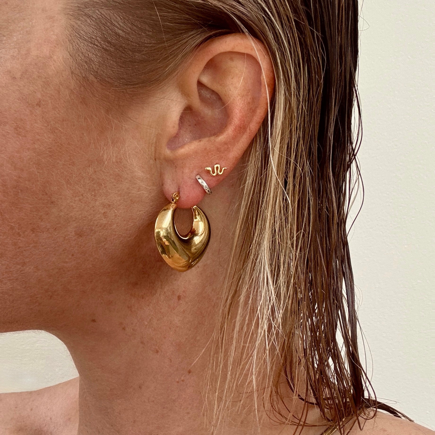 Gold plated chunky heart shaped hoop earrings from Jessica Rose jewellery